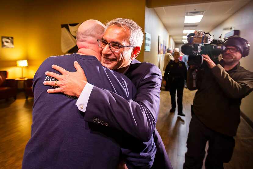 Tarrant County Republican Party  vice chair Dr. Shahid Shafi hugs a supporter after a...