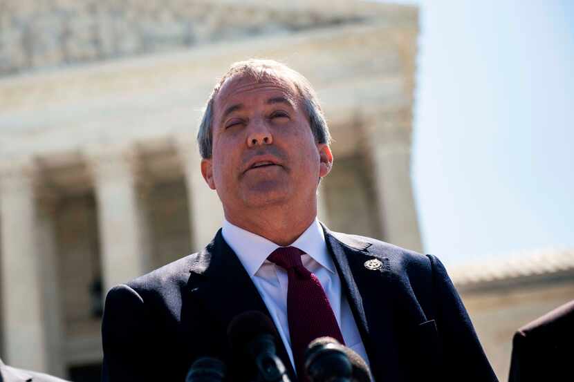 Texas Attorney General Ken Paxton stands outside the U.S. Supreme Court building in 2016....