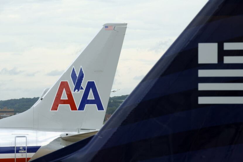 A private lawsuit is challening the December merger of American Airlines and US Airways ....