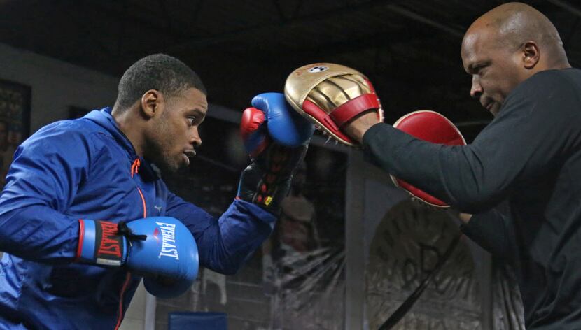 Boxer Errol Spence Jr. works out with trainer Derrick James at R&R Boxing Club in Dallas on...