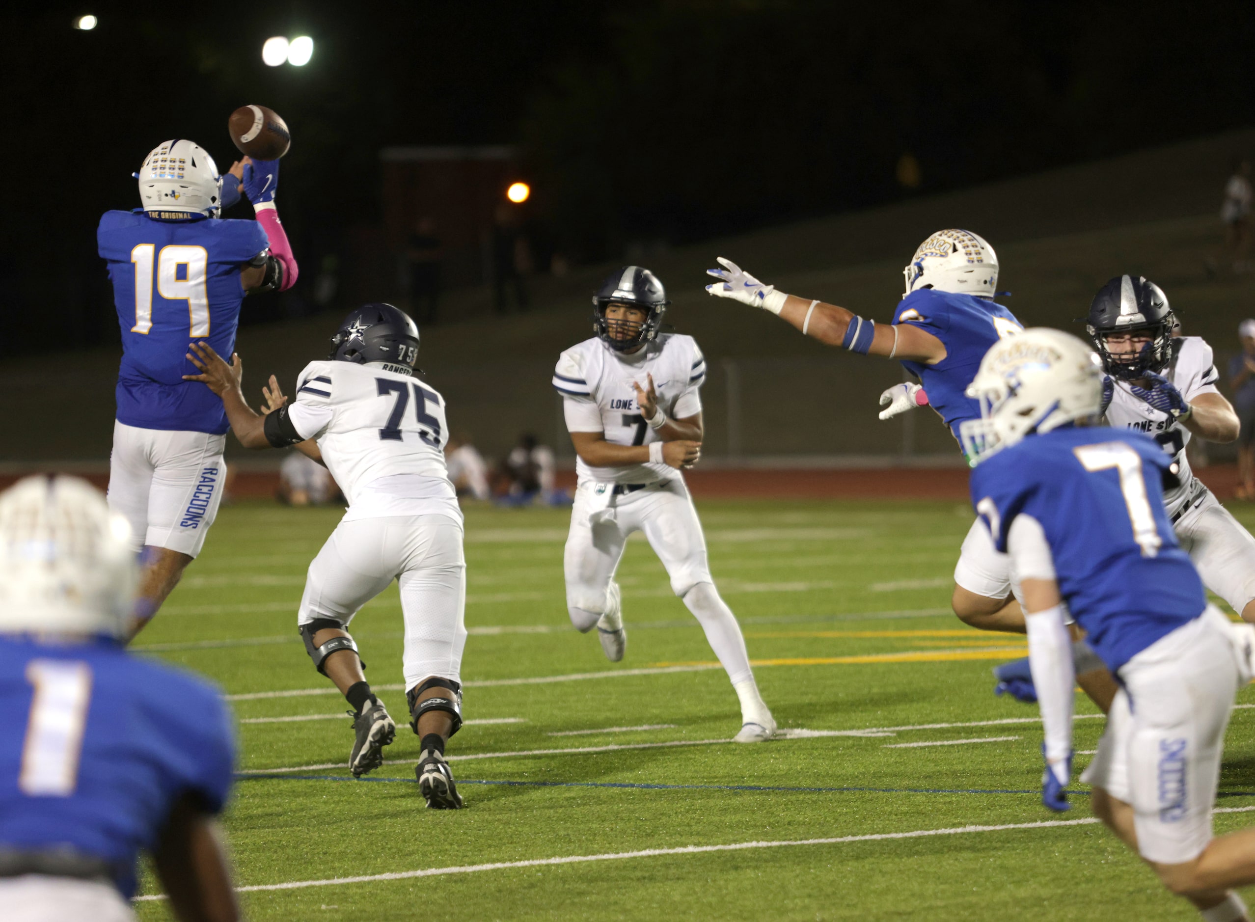 Frisco player #19 Isaiah Ivy jumps up to deflect a pass during the Frisco Lone Star High...