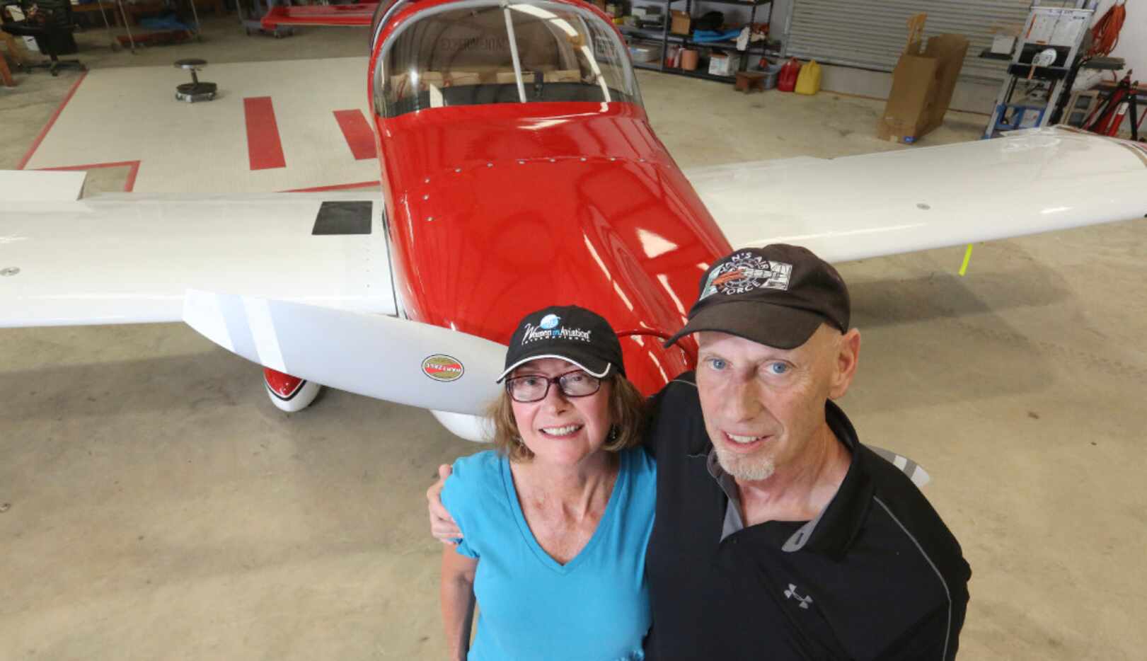 Susan Aronow and Rick Aronow with their single-engine plane. The plane, a Van's RV-7A...