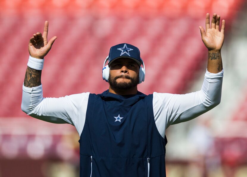 Dallas Cowboys quarterback Dak Prescott (4) warms up before an NFL game between the Dallas...