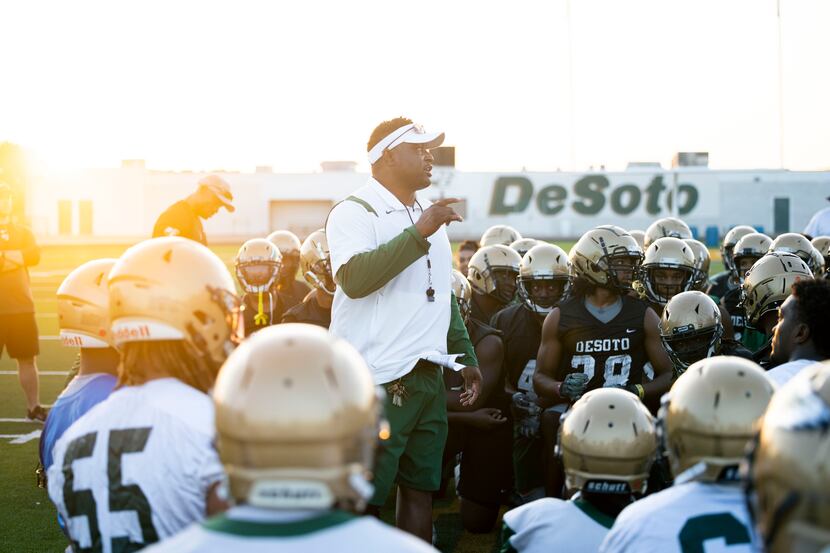 DeSoto football coach Claude Mathis talks to his team before the first practice of the...