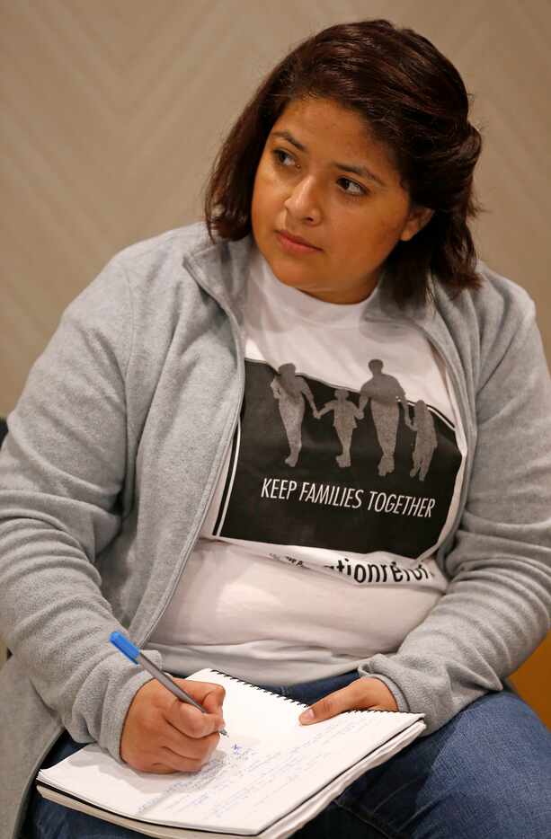Diana Ramirez takes a note during an immigration workshop at Kessler Park United Methodist...