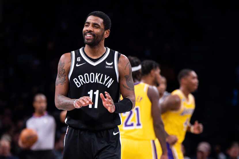 Brooklyn Nets guard Kyrie Irving (11) reacts during the second half of an NBA basketball...