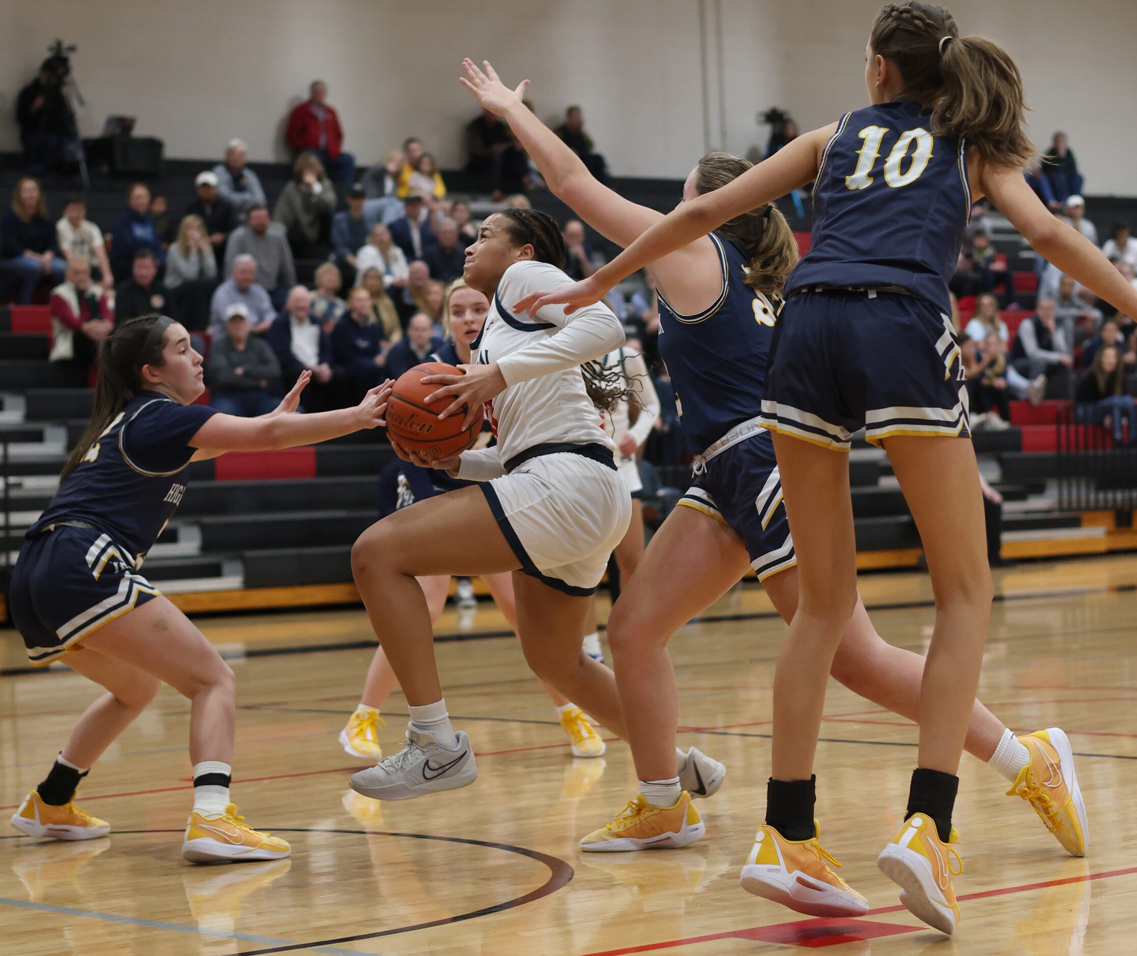 Allen's Aryn Roberts (23) works her way through a number of Highland Park defenders during a...