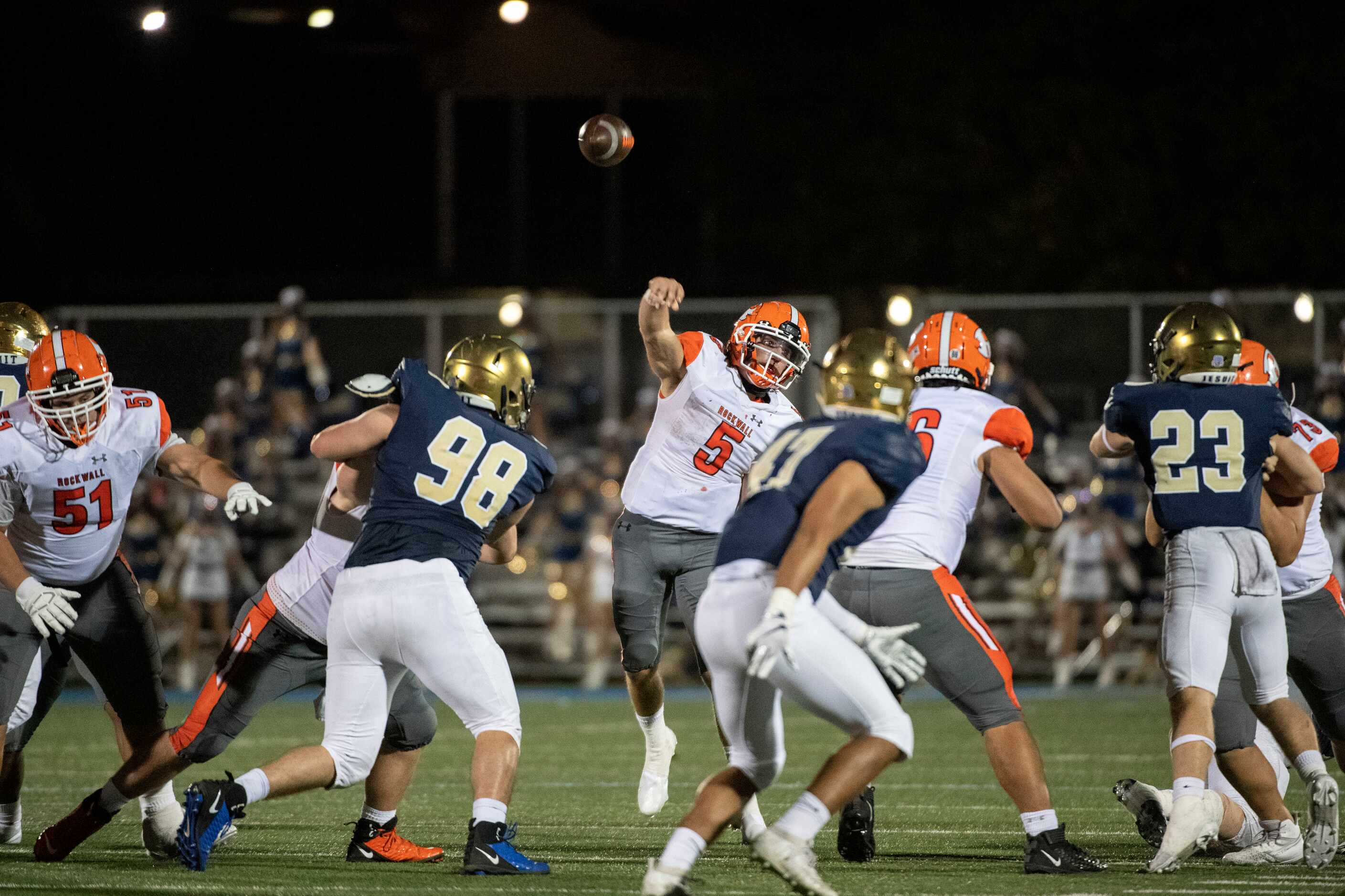 Rockwall sophomore quarterback Lake Bennett (5) throws a pass in the second half of a high...