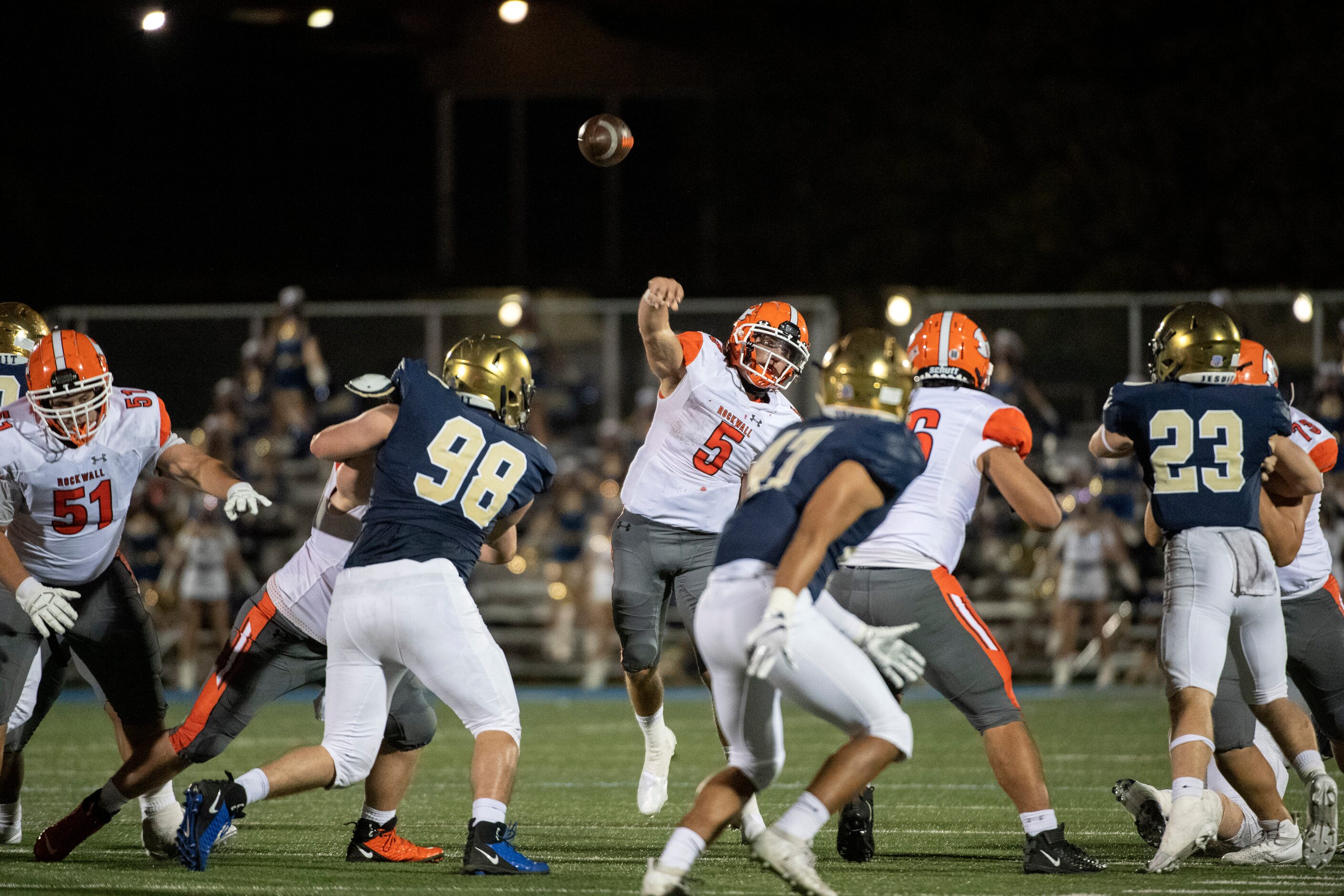 Rockwall sophomore quarterback Lake Bennett (5) throws a pass in the second half of a high...