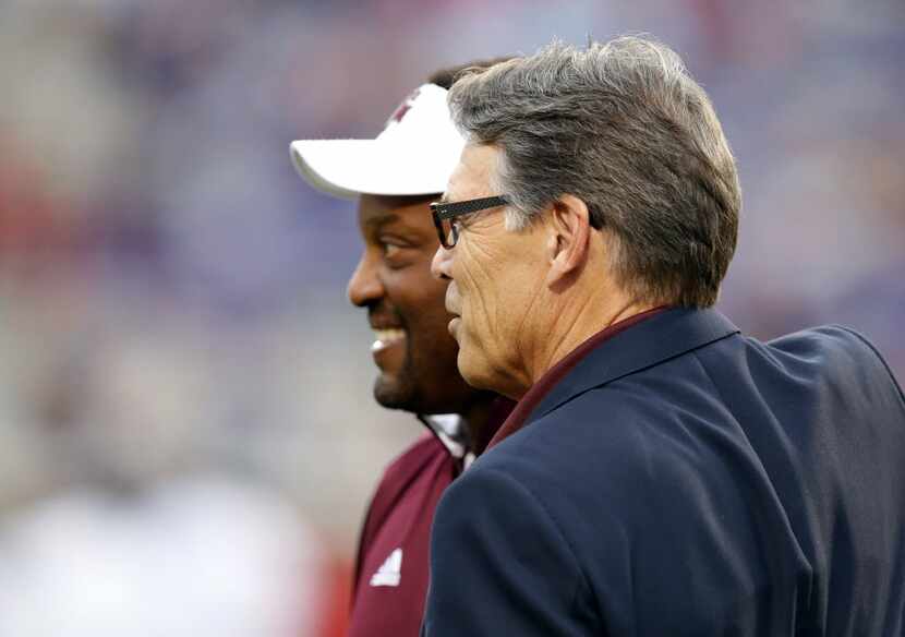 Energy Secretary Rick Perry, with Texas A&M football coach Kevin Sumlin, is a huge fan of...