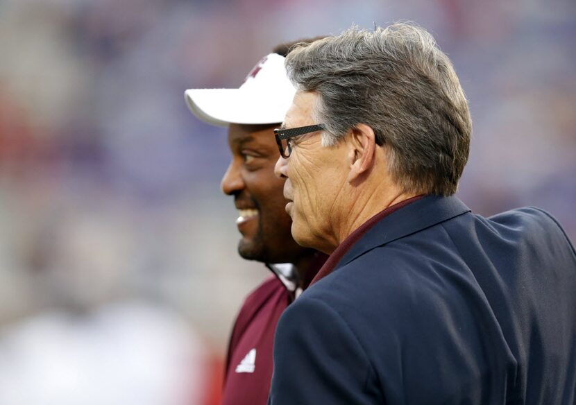 Energy Secretary Rick Perry, with Texas A&M football coach Kevin Sumlin, is a huge fan of...