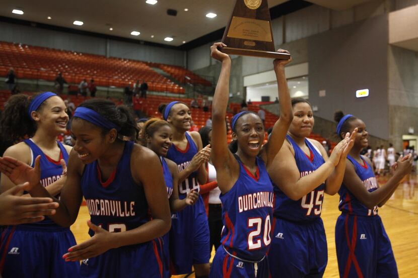 Duncanville Panthers' guard Tasia Foman (20) celebrates with the rest of the Lady Panthers...