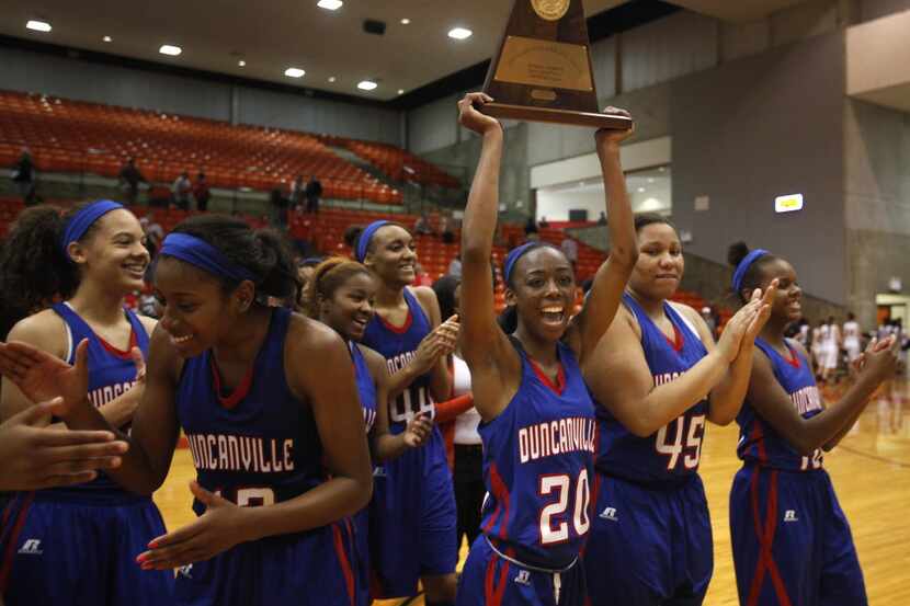 Duncanville Panthers' guard Tasia Foman (20) celebrates with the rest of the Lady Panthers...
