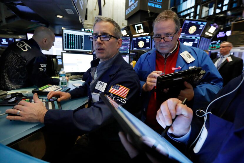 Specialist Anthony Rinaldi, left, and trader Michael Conlon worked on the floor of the New...