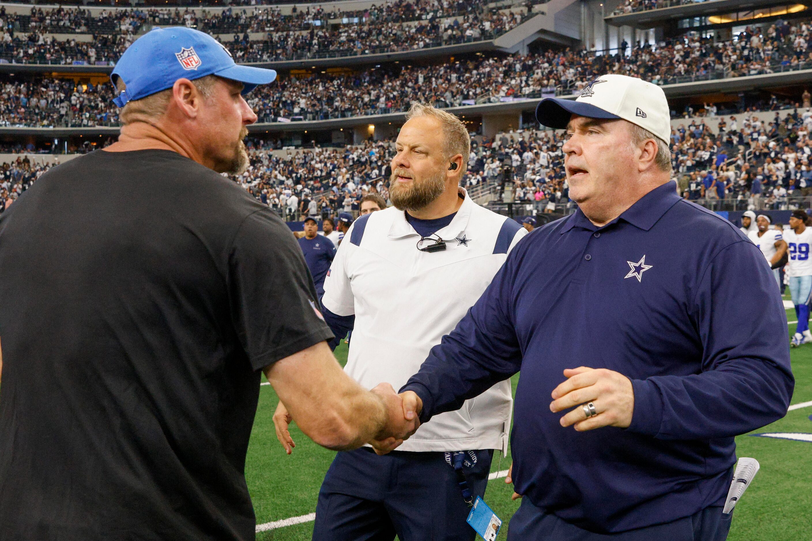 Dallas Cowboys head coach Mike McCarthy greets Detroit Lions head coach Dan Campbell after a...