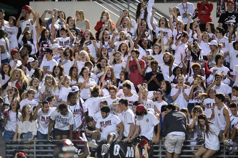 Braswell High School students celebrate after their football team defeats Wichita Falls at...