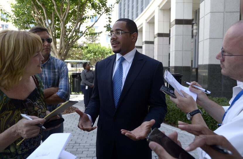 Chris Chestnut, center,from a 2012 press conference. (AP Photo/Phelan M. Ebenhack)