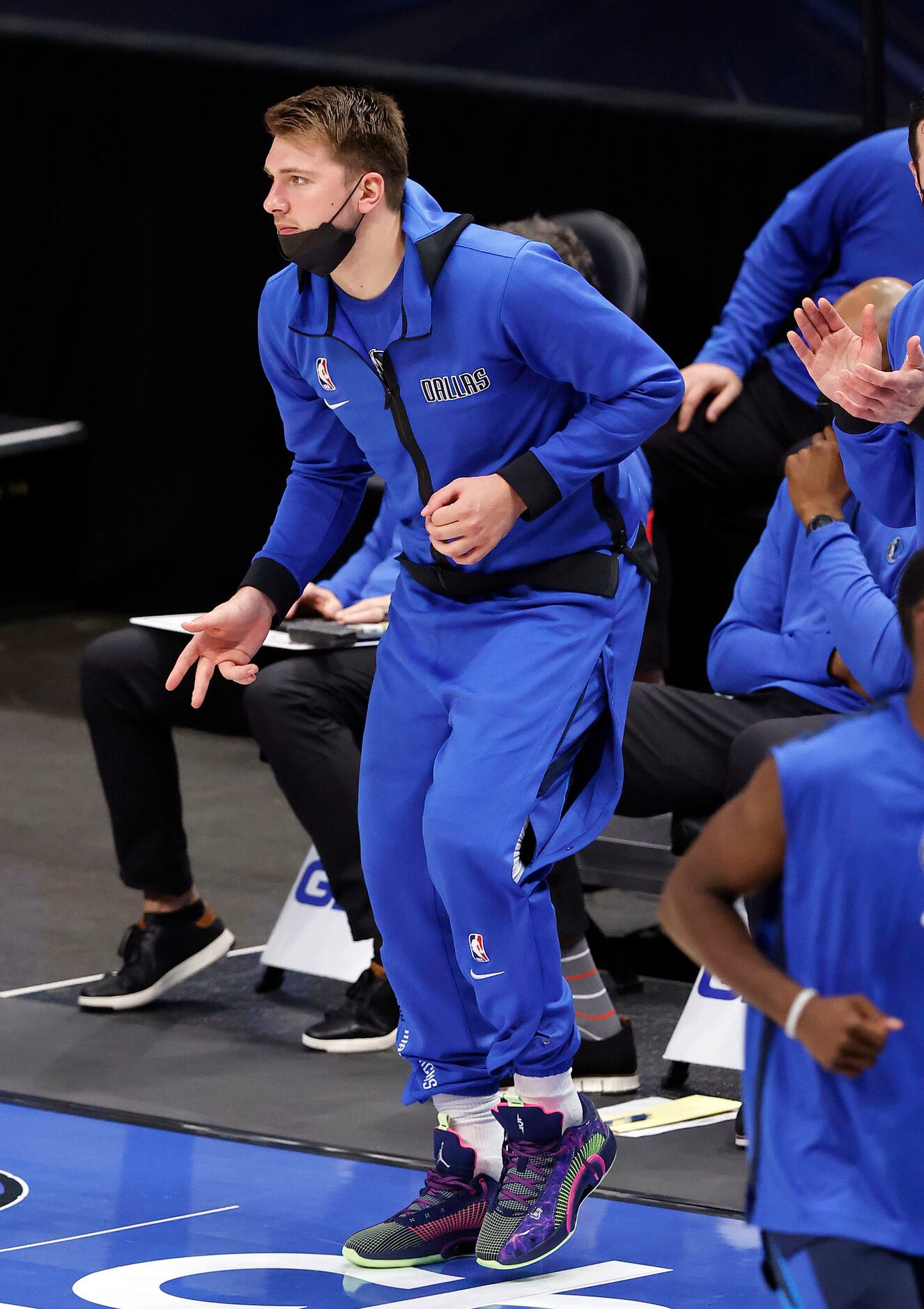 Dallas Mavericks guard Luka Doncic (77) dances along the sideline as the final  seconds tick...