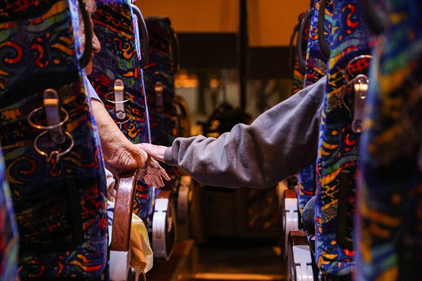 Gloria Sanders, 76, comforted by her mother, Maria Barajas, 100, as they spent the night on...