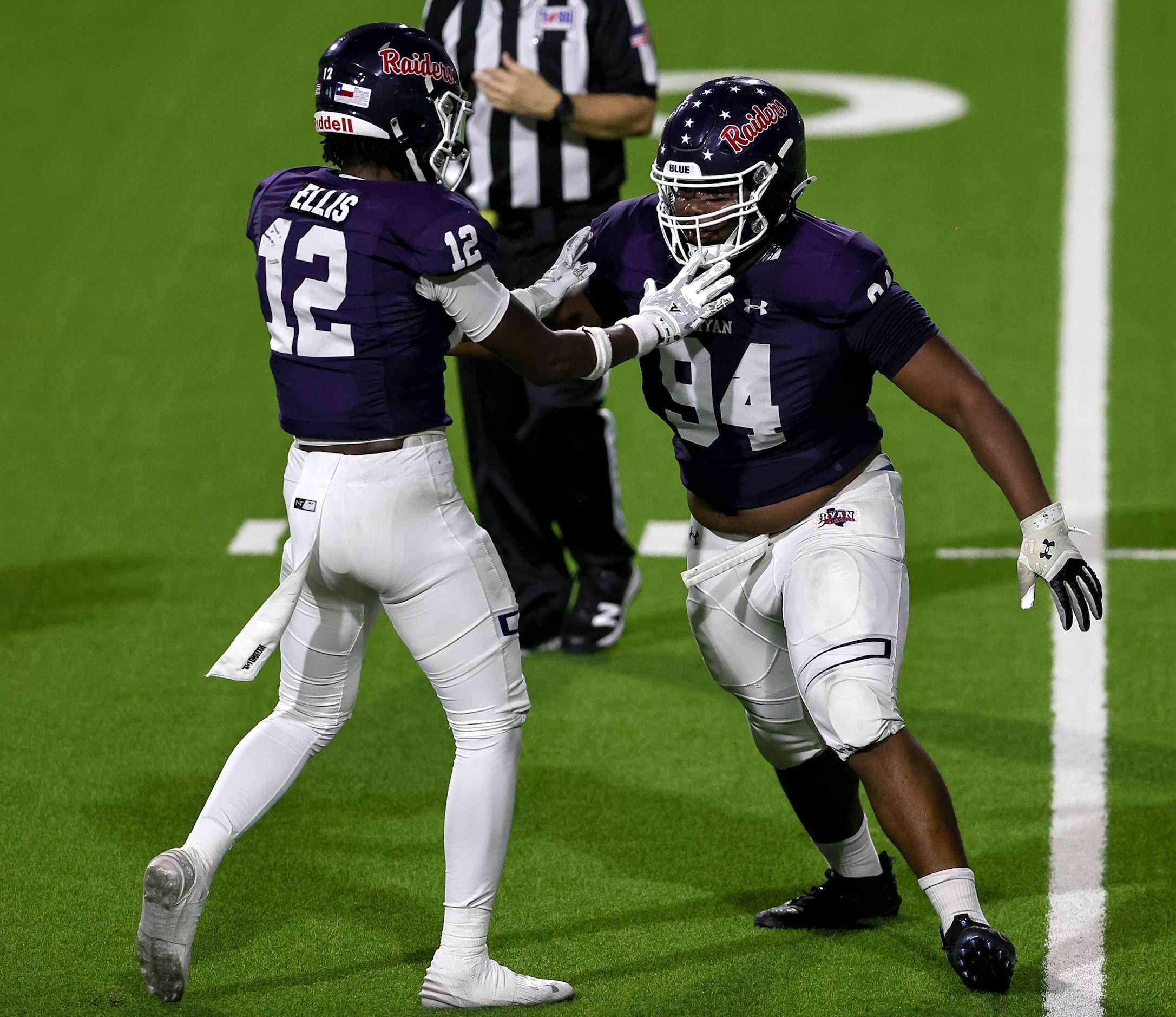 Denton Ryan defensive lineman Tre'Von Bates (94) celebtates with defensive back Mun'terrius...