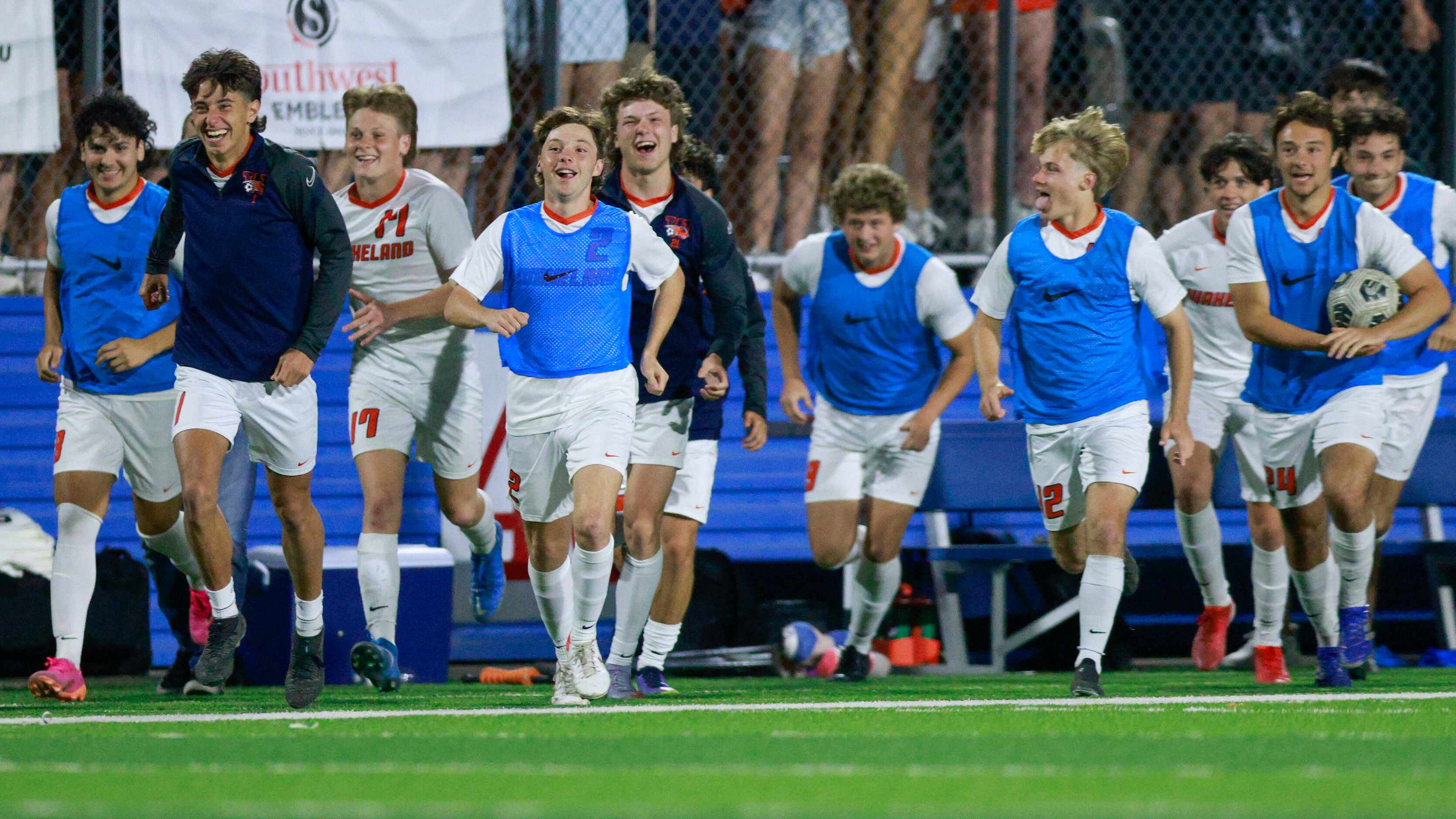 Frisco Wakeland players rush the field after winning a Class 5A boys soccer state semifinals...