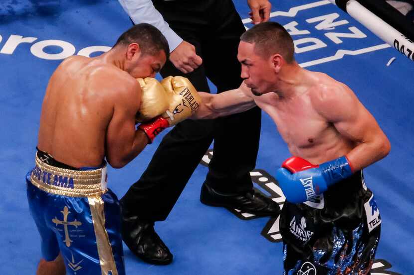 Juan Francisco Estrada, right, lands a punch on Roman Gonzalez during the WBC, WBA and Ring...