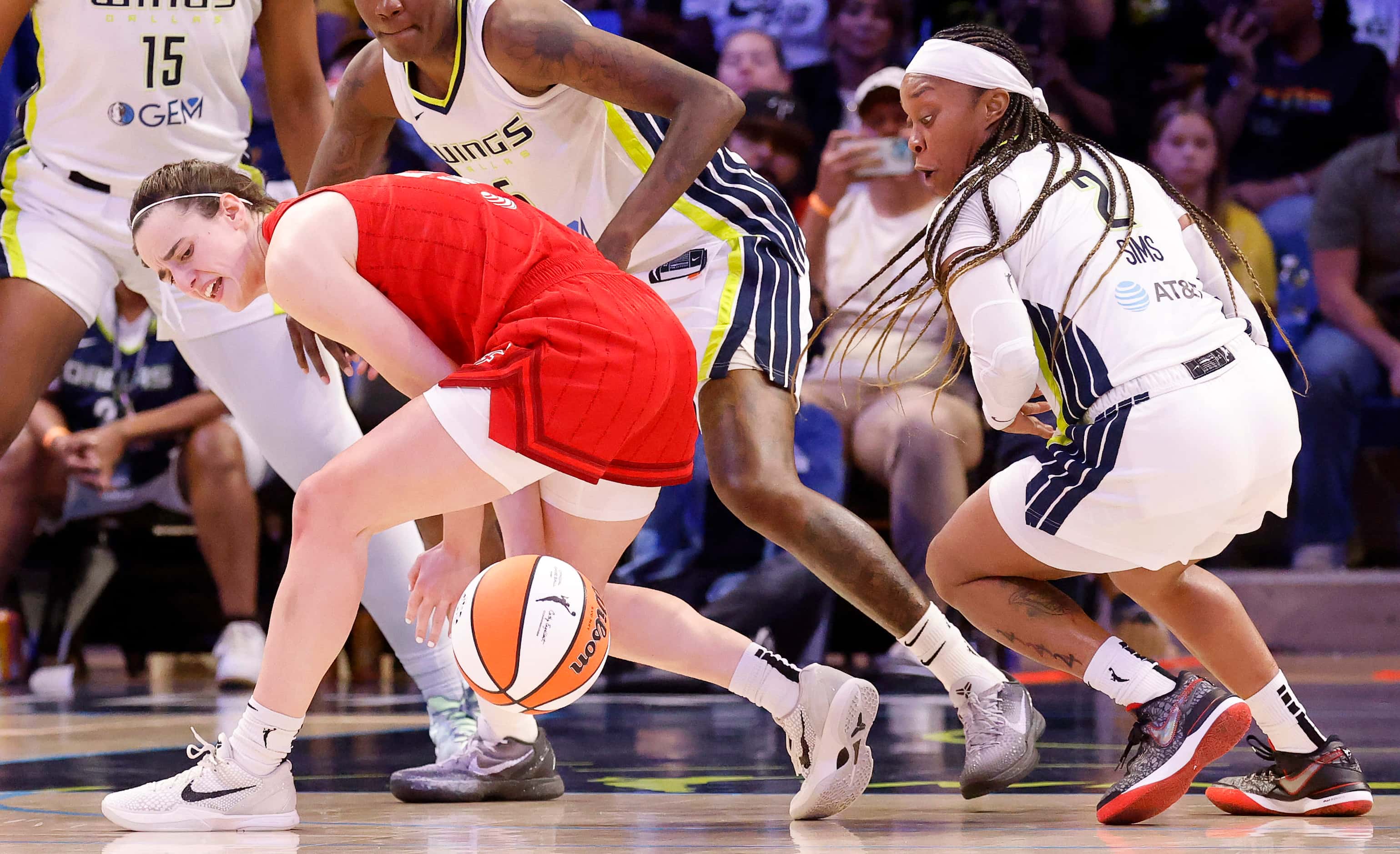 Indiana Fever guard Caitlin Clark (22) looses the ball after turning it over to Dallas Wings...