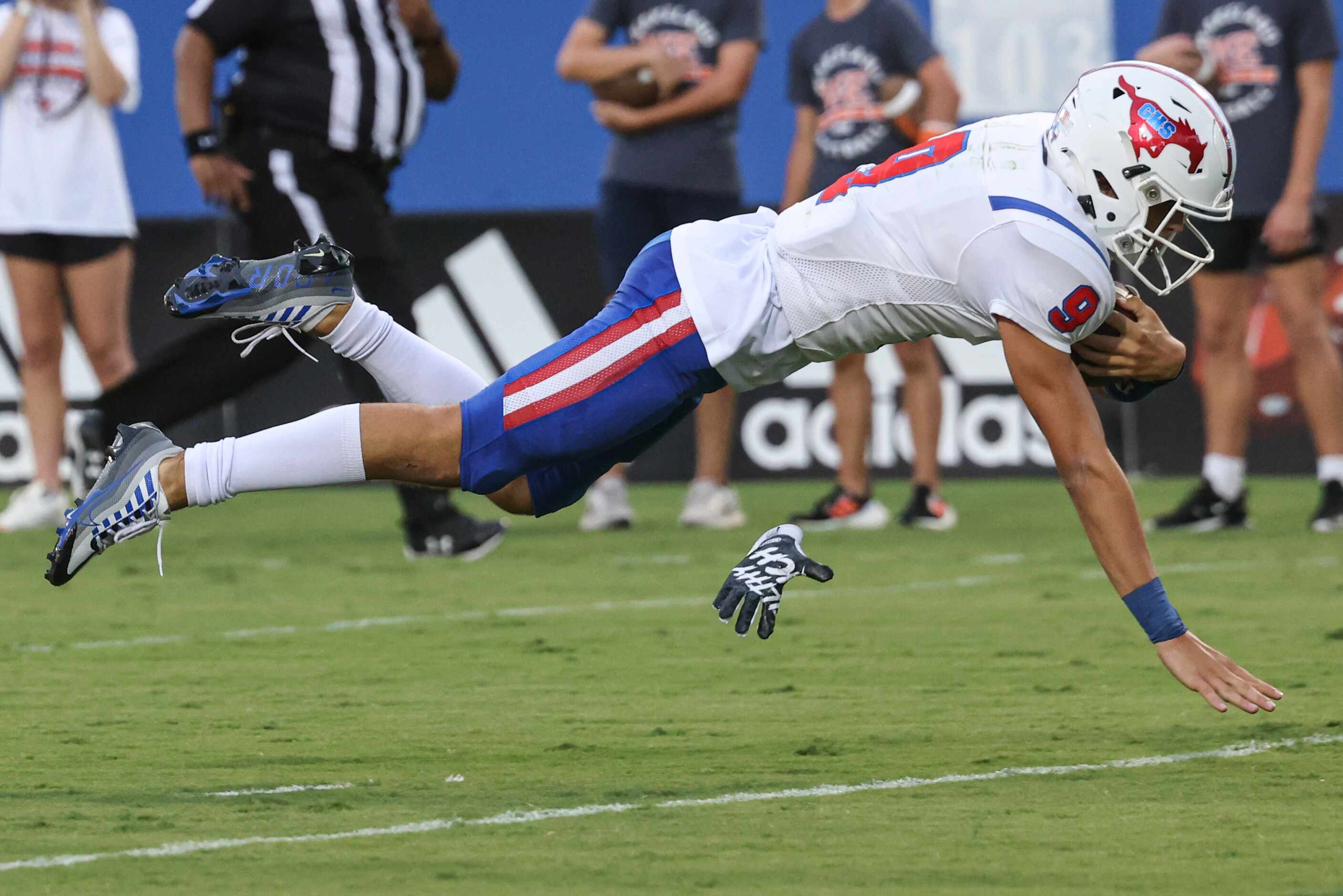 Grapevine High School’s  Evan Baum (9) dives into the in zone during the second quarter of...