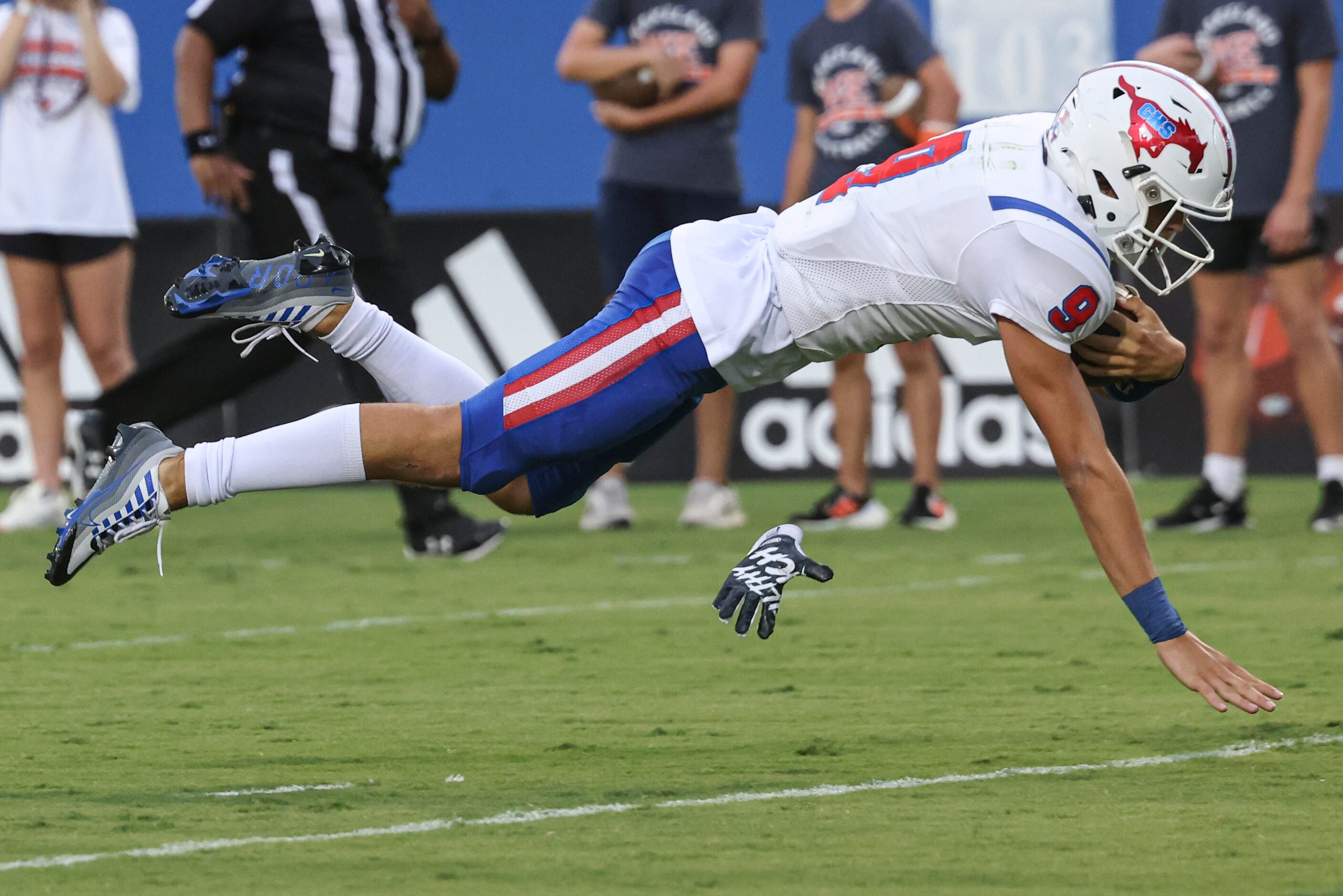 Grapevine High School’s  Evan Baum (9) dives into the in zone during the second quarter of...