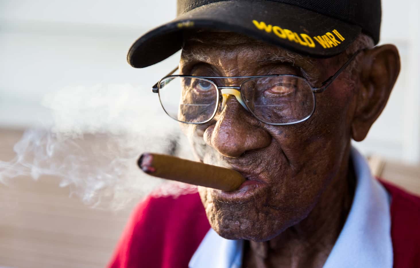 Richard Overton, 111, smokes a cigar on his front porch on Thursday, May 25, 2017, in...