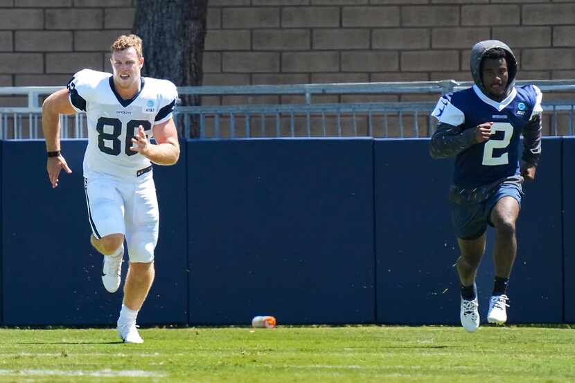 Dallas Cowboys tight end Luke Schoonmaker (86) runs to the side of practice with cornerback...