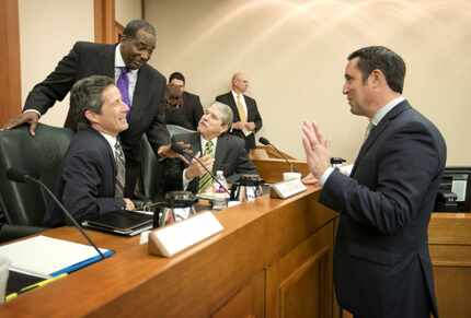 Comptroller Glenn Hegar, right, has floated the idea of investing surplus rainy-day dollars...