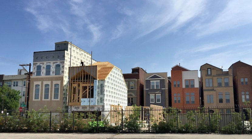 Construction work continues at a rapid pace in the Cedars area south of downtown .