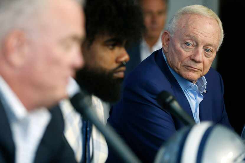 Dallas Cowboys owner and general manager Jerry Jones listens as Dallas Cowboys executive...