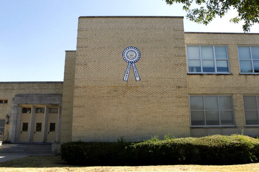 A sign touts Stonewall Jackson Elementary School in Dallas as a "National Blue Ribbon School...