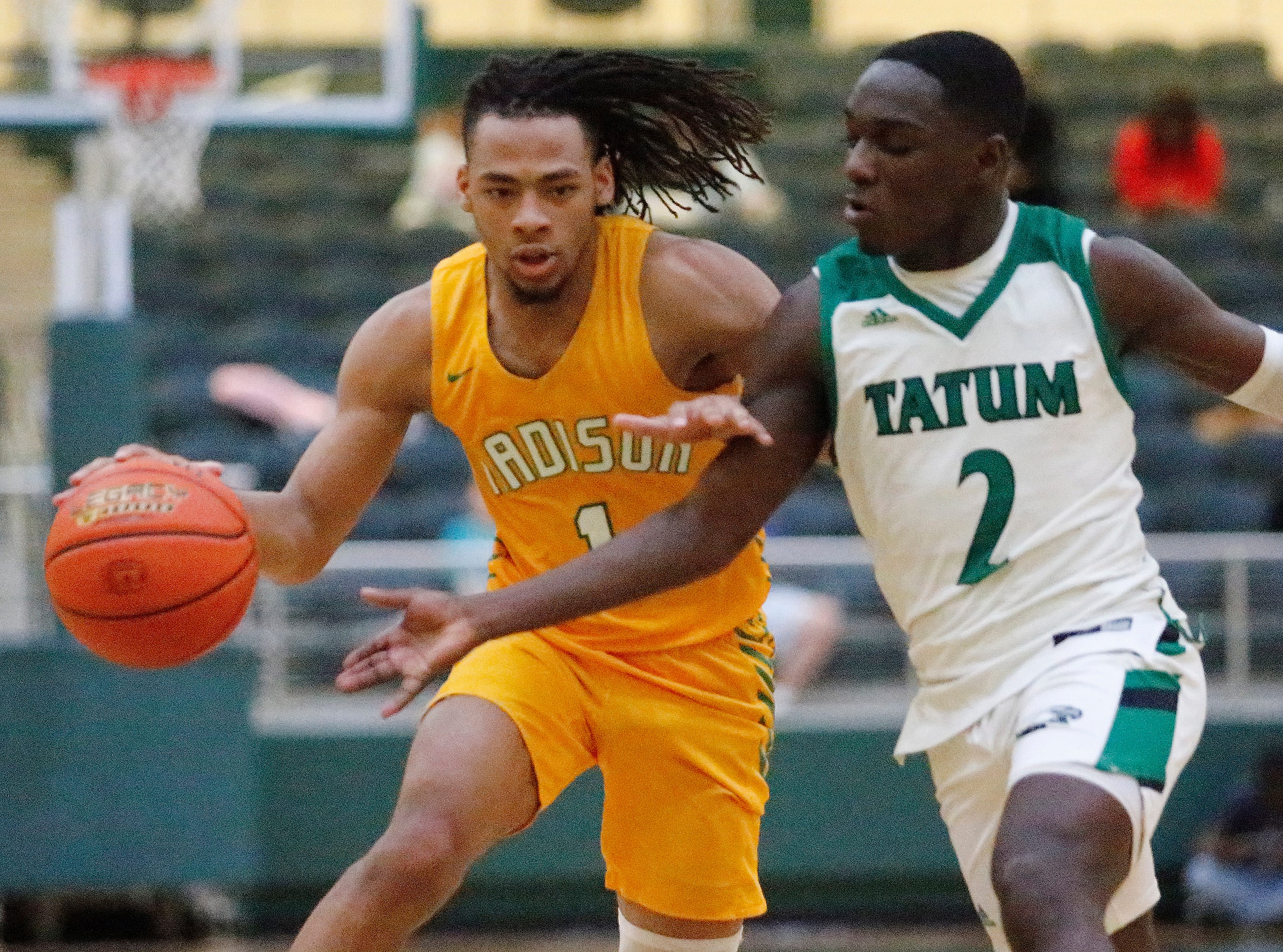 Madison guard Pierre Hunter (1) attempts a fast break as Tatum guard Kendall Williams...