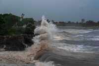 Waves from Hurricane Beryl hit the seawall in Santo Domingo, Dominican Republic, Tuesday,...