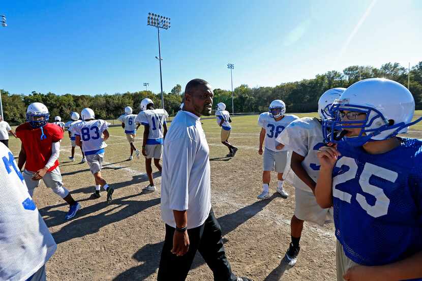 Conrad football coach M.T. Tyeskie instructs his players during practice in 2017. (Jae S....