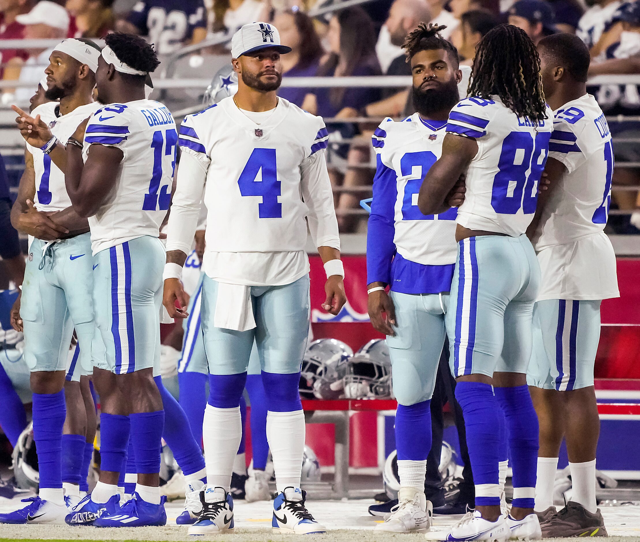 Dallas Cowboys quarterback Dak Prescott (4) watches from the sidelines with wide receiver...