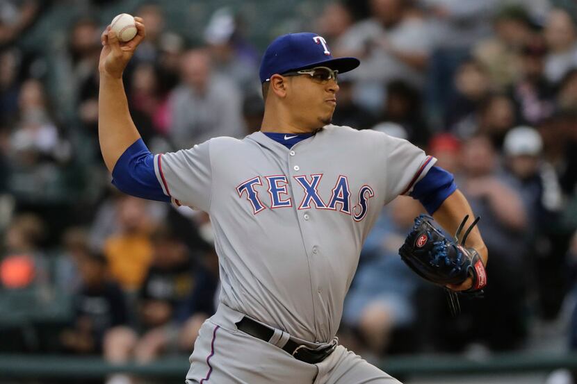 Texas Rangers starting pitcher Ariel Jurado throws against the Chicago White Sox during the...