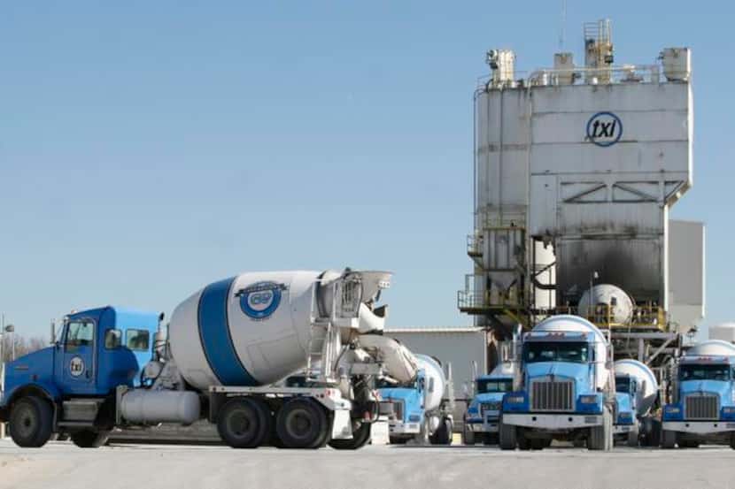 
Cement trucks sit outside a Texas Industries Inc. plant in Dallas. Texas Industries Inc., a...
