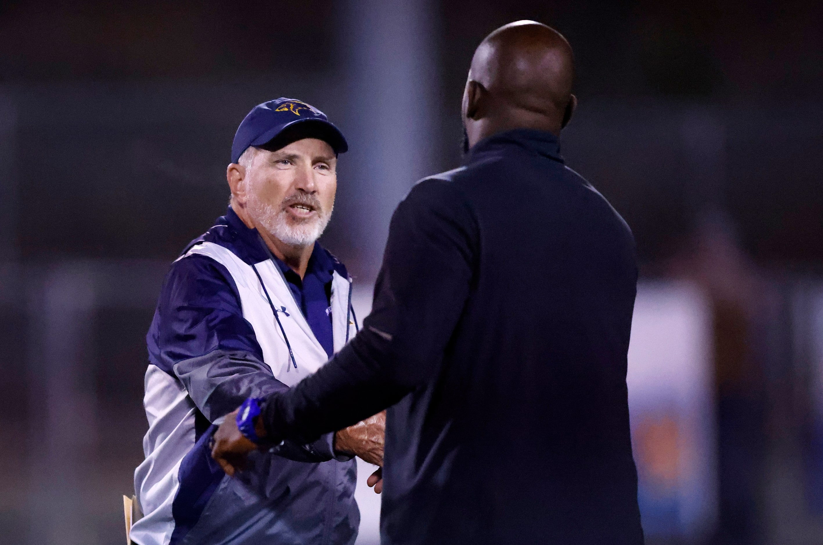 Plano Prestonwood Christian Academy head coach Chris Cunningham (left) congratulates Fort...