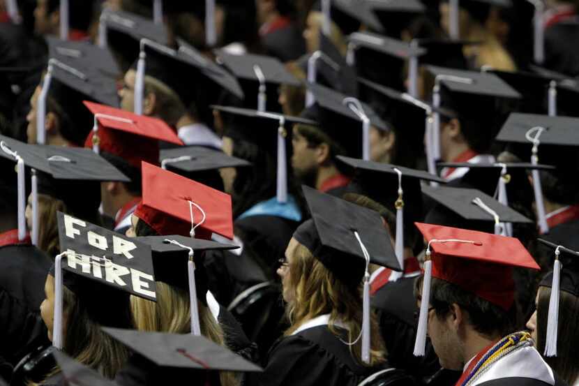  In this Saturday, Aug. 6, 2011 file picture, students attend graduation ceremonies at the...