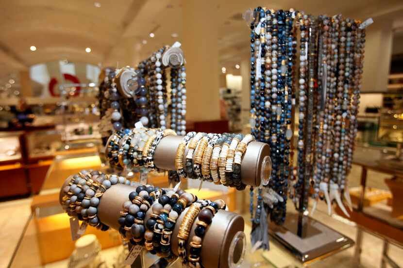 Akola necklaces and bracelets are on display inside NorthPark Center. Akola hires and trains...