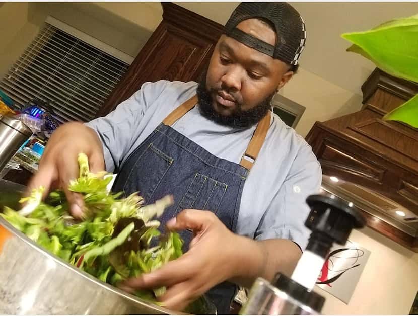 Cal Abbott prepares a salad for his Dallas catering company, Destination Catering and...