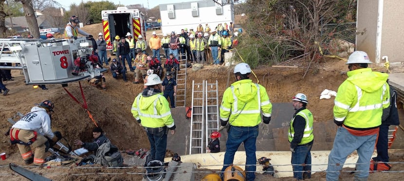 Rescue crews respond to a man trapped in a 54-inch pipe at a water treatment plant Monday in...