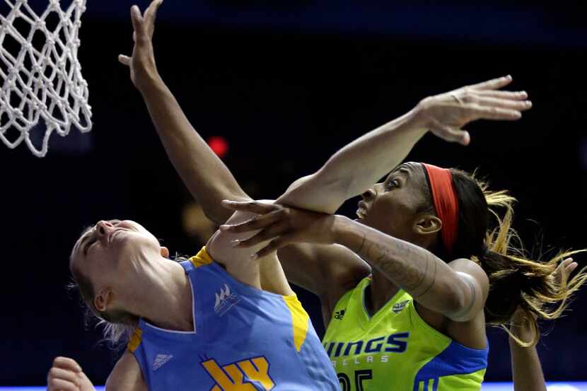 Dallas Wings forward Glory Johnson, right, scores a basket against Chicago Sky guard Allie...