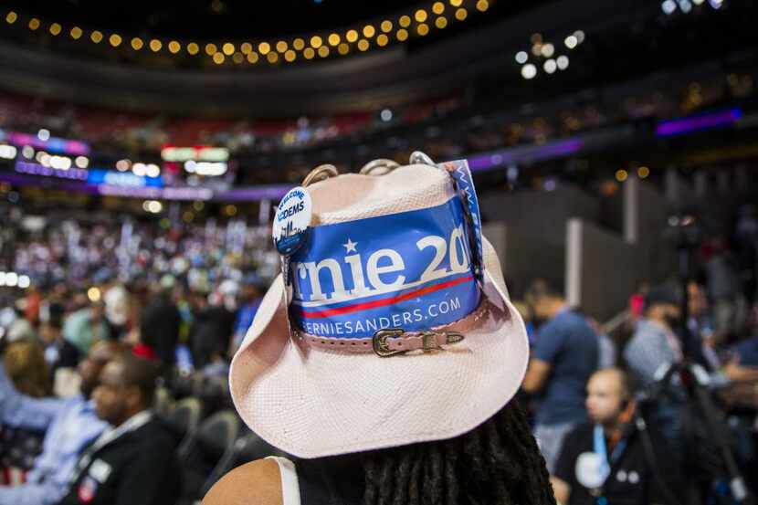 A Bernie Sanders supporter makes her way through the floor during day two of the Democratic...