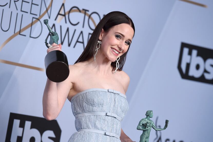 Rachel Brosnahan poses with the awards for outstanding performance by a female actor in a...