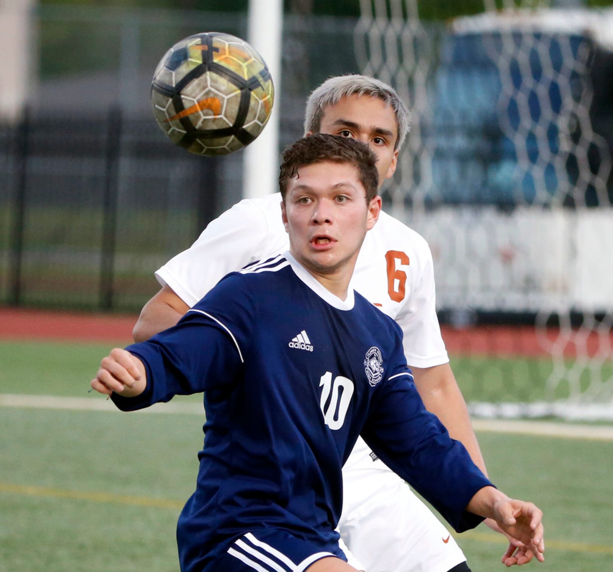 Flower Mound's Hector Torres (10) and W.T White's Alfredo Guillen (6) watch the ball during...